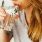 woman drinking glass of water