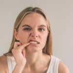 woman with gum pain