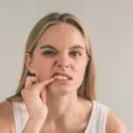 woman with gum pain