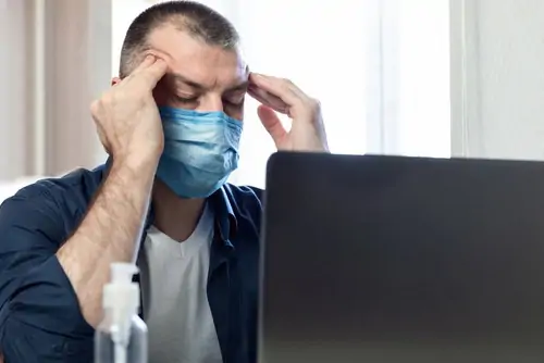 stressed man in mask